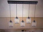 Goyeel Crystria 5-LIGHT Matte Black Farmhouse Clear Crystal Linear Pendant. Fixed Price $165.25.