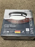 Hampton Bay 11 In. Round Black Integrated 3-CCT Led Ceiling Light Flush Mount. Fixed Price $29.99.