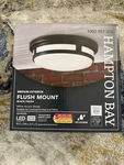 Hampton Bay 11 In. Round Black Integrated 3-CCT Led Ceiling Light Flush Mount. Fixed Price $28.99.