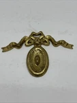 Vintage Architectural Brass Medallion With Ribbon Wall Plaque Embellishment. Fixed Price $19.99.