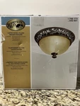 Hampton Bay Caffe Patina Flush Mount Fixture With Scroll And Leaf Accents. Fixed Price $44.25.