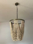 Cyan Design One Light Draped Wood Beaded Chandelier Ceiling Fixture. Fixed Price $465.99.