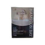 Hampton Bay Ashhurst 2-LIGHT Brushed Nickel Vanity With Frosted Glass Shad. Fixed Price $22.00.