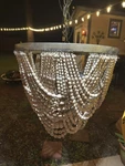 Creative Co-op Metal Chandelier With Draped Wood Beads 25" X 26. Fixed Price $295.00.