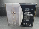 Hampton Bay Nelwyn 1-LIGHT Vintage Brass Pendant With Clear Glass Globe Shade. Fixed Price $49.99.