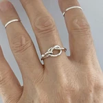 Sterling Silver Hooked Love Knot Ring,. Fixed Price $32.99.