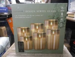 Lumipur 6-PC Centerpiece Flickering Led Glass Pillar Candles W/remote Nob. Fixed Price $57.99.